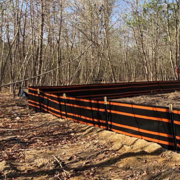 SMARTfence 48 lining construction site in wooded area