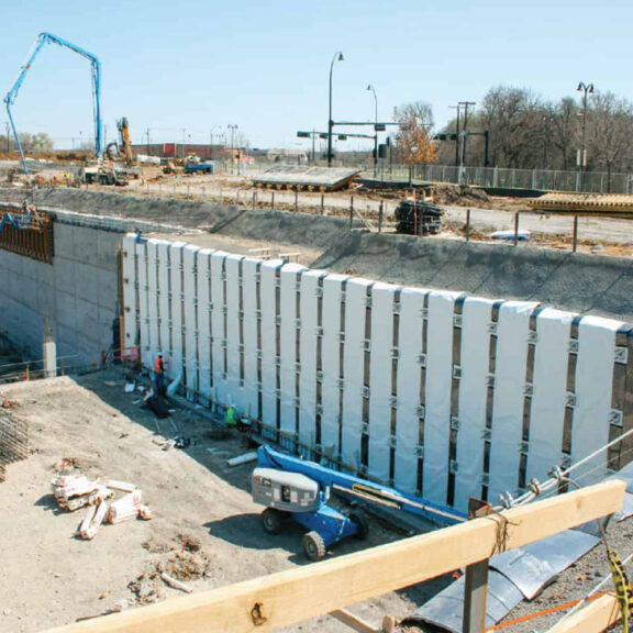 Vertical strip drain in retaining wall