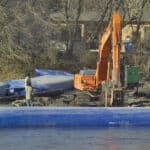 AquaBarrier lining a large body of water in order to help prevent flooding