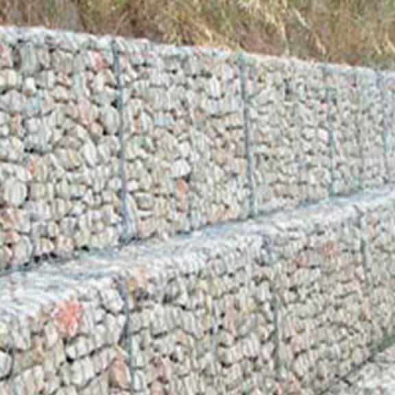 Stacked cage gabion filled with rock for construction foundation