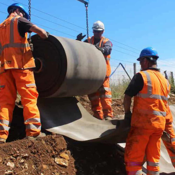 Installing rolled concrete fabric