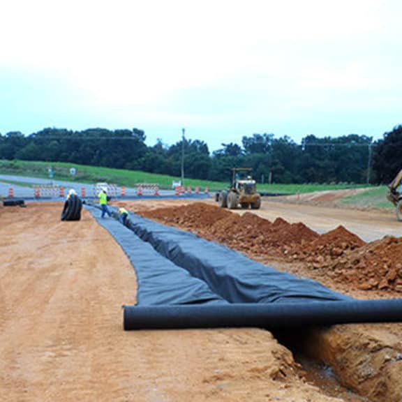 Using heavy-weight nonwoven geotextile to prevent soil from eroding through drainage passage