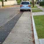 STORMCRETE porous concrete slabs in a road gutter to better control stormwater runoff.