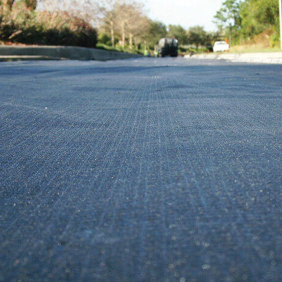 Newly installed Tensar GlasPave for moisture mitigation on roadway.