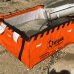 Cement being washed out in a movable containment box