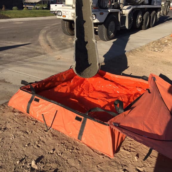 A portable concrete washout berm ready for use