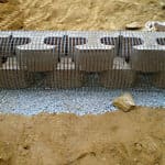 Cement blocks reinforced with 4" uniaxial geogrid for slope and wall stabilization