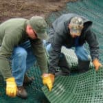 Two erosion control professionals installing Shoremax