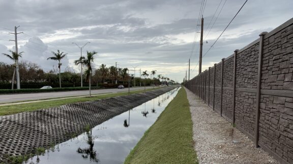 Nicely landscaped Florida roadside after erosion control hydro turf is installed.