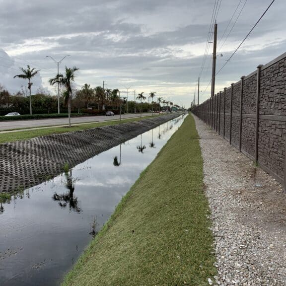 Nicely landscaped Florida roadside after erosion control hydro turf is installed.