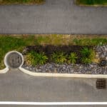 Roadside turrets guiding runoff into a FocalPoint Bioretention System.