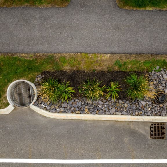 Roadside turrets guiding runoff into a FocalPoint Bioretention System.