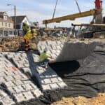 Large machinery laying articulated concrete block in Ohio