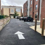 A small alley with underground utilities and shallow stormwater detention modules.