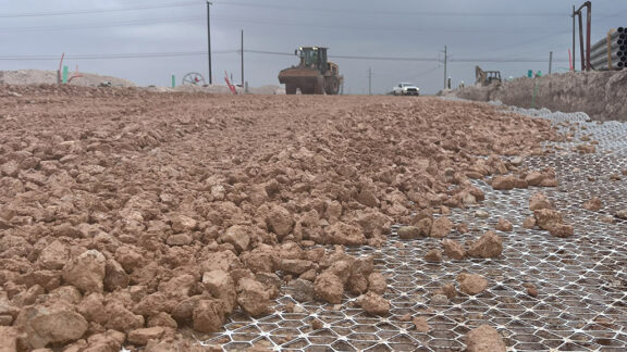 Tensar InterAx Geogrid providing stabilization for a new community development project.