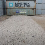 Tensar NX850 supporting gravel entrance in container yard that uses heavy machinery.