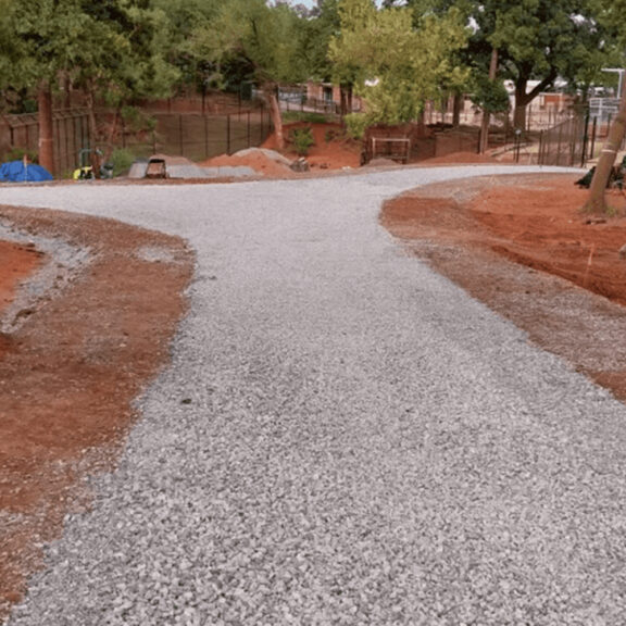 Visually pleasing sidewalk solution at the Oklahoma zoo uses permeable pavers from Ferguson.