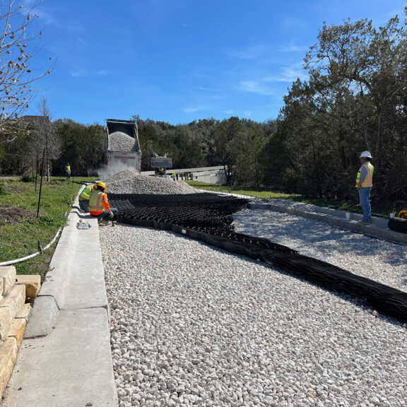 Installing Presto Geoweb over aggregate to stabilize the evacuation road.