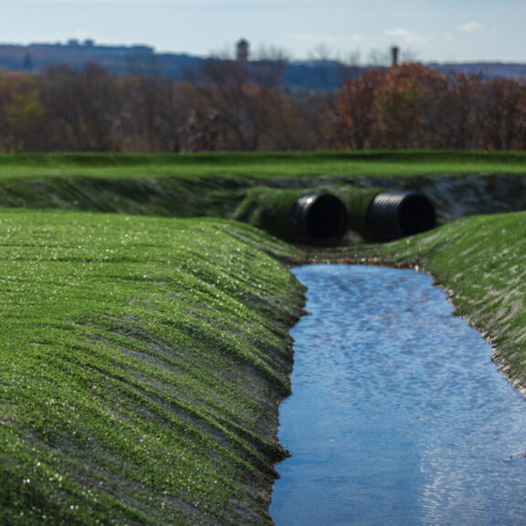 Vegetated hard armor lining culvert.