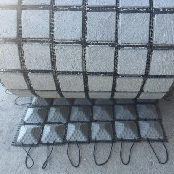 Conveniently rolled concrete blocks, shoreflex, for easy transport and delivery.